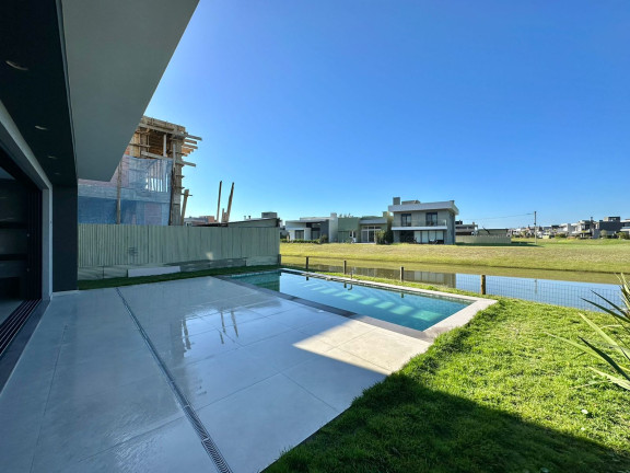 Imagem Casa de Condomínio com 4 Quartos à Venda, 250 m²em Zona Nova - Capão da Canoa