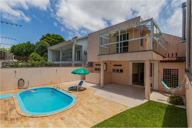 Imagem Casa com 4 Quartos à Venda, 330 m² em Nonoai - Porto Alegre