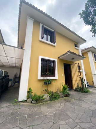 Imagem Casa de Condomínio com 3 Quartos à Venda, 102 m² em Partenon - Porto Alegre