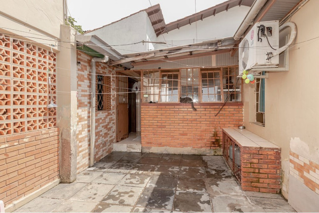 Imagem Casa com 4 Quartos à Venda, 170 m² em Vila Nova - Porto Alegre