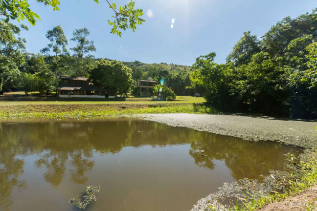 Imagem Sobrado com 3 Quartos à Venda, 16.384 m² em Campo Novo - Porto Alegre