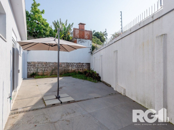 Imagem Casa com 3 Quartos à Venda, 400 m² em Três Figueiras - Porto Alegre