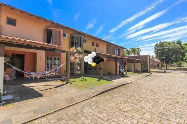 Imagem Casa com 4 Quartos à Venda, 117 m² em Cavalhada - Porto Alegre