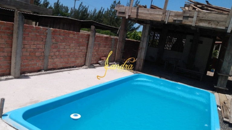 Imagem Casa com 2 Quartos para Alugar ou Temporada, 52 m² em Capão Novo - Capão Da Canoa