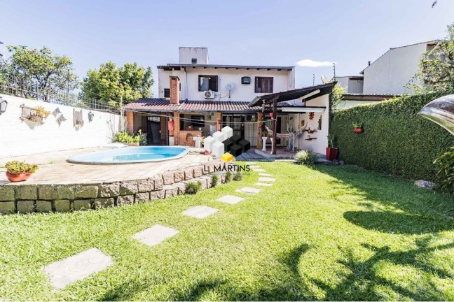 Imagem Casa com 3 Quartos à Venda, 235 m² em Guarujá - Porto Alegre Imagem Casa com 3 Quartos à Venda, 235 m² em Guarujá - Porto Alegre