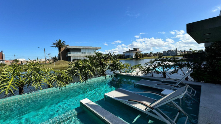 Imagem Casa com 4 Quartos à Venda, 184 m² em Condominio Riviera Xangri-la - Xangri-lá