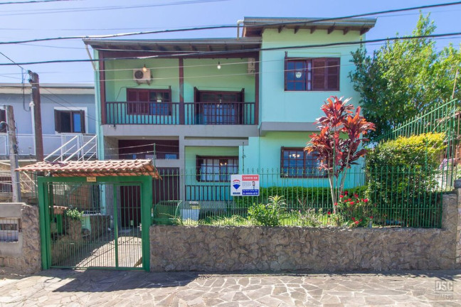 Imagem Casa com 3 Quartos à Venda, 216 m² em Vila Nova - Porto Alegre