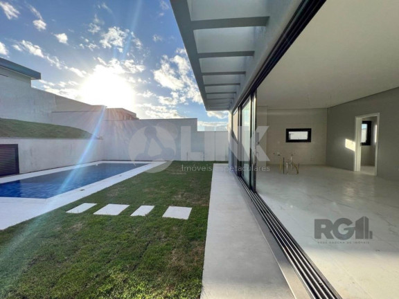 Imagem Imóvel com 4 Quartos à Venda, 371 m² em Vila Nova - Porto Alegre
