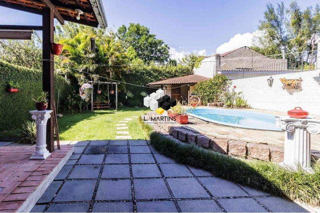 Imagem Casa com 3 Quartos à Venda, 235 m² em Guarujá - Porto Alegre Imagem Casa com 3 Quartos à Venda, 235 m² em Guarujá - Porto Alegre