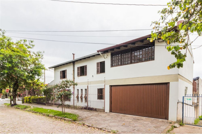 Imagem Casa com 4 Quartos à Venda, 313 m² em Cavalhada - Porto Alegre