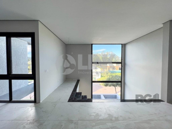 Imagem Imóvel com 4 Quartos à Venda, 371 m² em Vila Nova - Porto Alegre