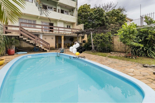 Imagem Casa com 3 Quartos à Venda, 464 m² em Santo Antônio - Porto Alegre Imagem Casa com 3 Quartos à Venda, 464 m² em Santo Antônio - Porto Alegre
