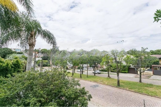 Imagem Casa com 4 Quartos à Venda, 239 m² em Nonoai - Porto Alegre