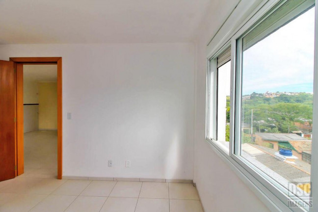 Imagem Imóvel com 1 Quarto à Venda, 44 m² em Vila Nova - Porto Alegre Imagem Imóvel com 1 Quarto à Venda, 44 m² em Vila Nova - Porto Alegre