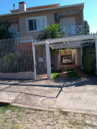 Imagem Casa com 4 Quartos à Venda, 243 m² em Partenon - Porto Alegre Imagem Casa com 4 Quartos à Venda, 243 m² em Partenon - Porto Alegre