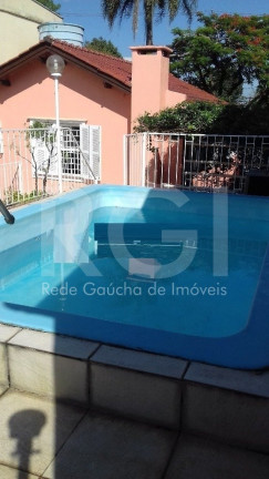 Imagem Casa com 3 Quartos à Venda, 422 m² em Santo Antônio - Porto Alegre Imagem Casa com 3 Quartos à Venda, 422 m² em Santo Antônio - Porto Alegre