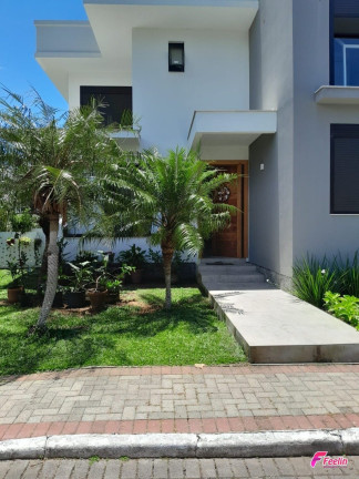 Imagem Casa de Condomínio com 4 Quartos à Venda, 288 m² em Cachoeira Do Bom Jesus - Florianópolis