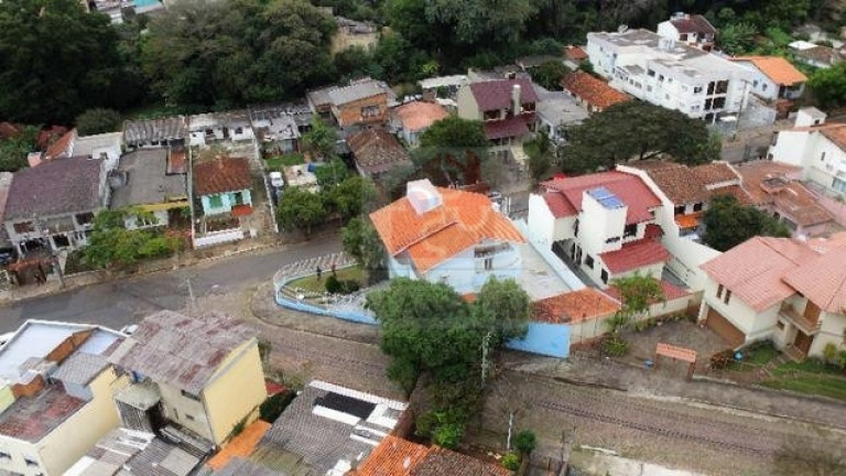 Imagem Casa com 4 Quartos à Venda, 350 m² em Nonoai - Porto Alegre Imagem Casa com 4 Quartos à Venda, 350 m² em Nonoai - Porto Alegre