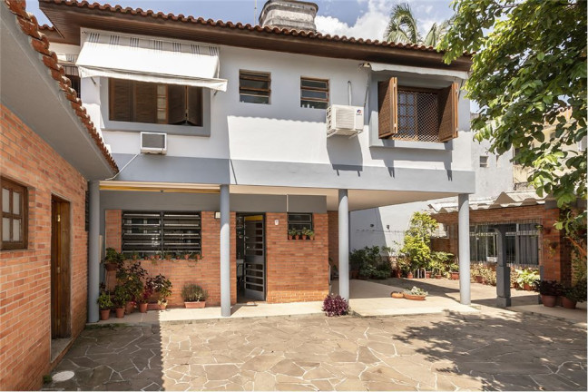 Imagem Casa com 4 Quartos à Venda,  em Três Figueiras - Porto Alegre