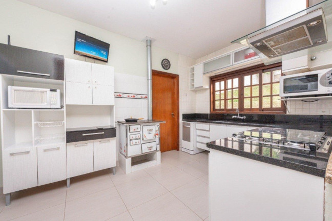 Imagem Casa com 4 Quartos à Venda, 234 m² em Santa Felicidade - Curitiba
