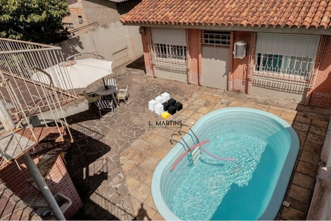 Imagem Casa com 4 Quartos à Venda, 381 m² em Camaquã - Porto Alegre Imagem Casa com 4 Quartos à Venda, 381 m² em Camaquã - Porto Alegre
