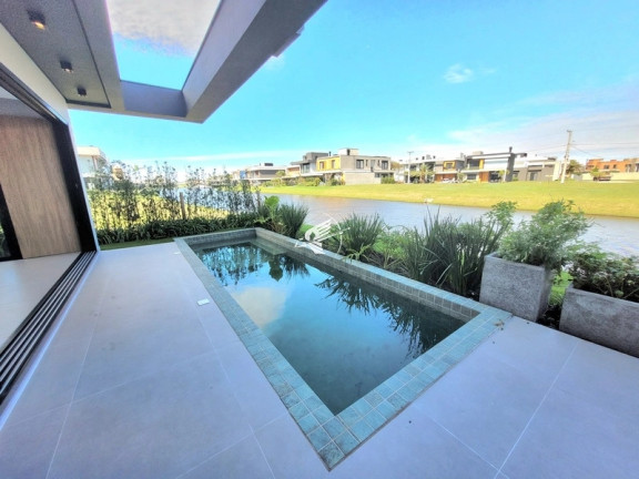 Imagem Casa de Condomínio com 4 Quartos à Venda, 226 m² em Sunset - Xangri-lá Imagem Casa de Condomínio com 4 Quartos à Venda, 226 m² em Sunset - Xangri-lá