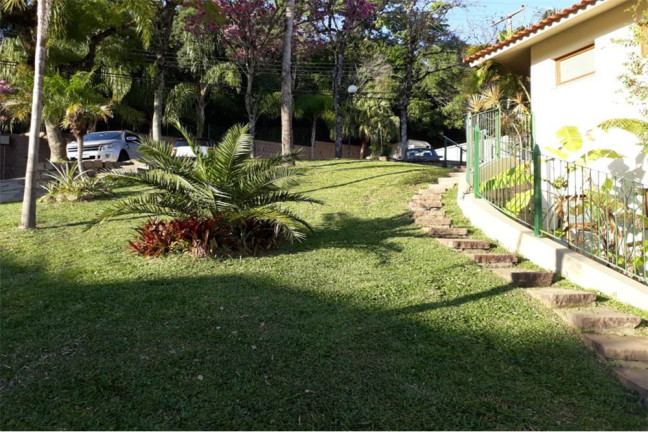 Imagem Casa de Condomínio com 4 Quartos à Venda, 195 m² em Teresópolis - Porto Alegre