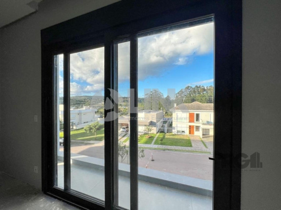 Imagem Imóvel com 4 Quartos à Venda, 371 m² em Vila Nova - Porto Alegre