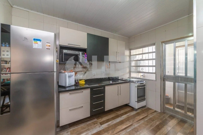 Imagem Casa com 4 Quartos à Venda, 299 m² em Santana - Porto Alegre